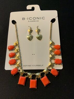 B. Iconic Coral and Gold Statement Necklace with Matching Earrings